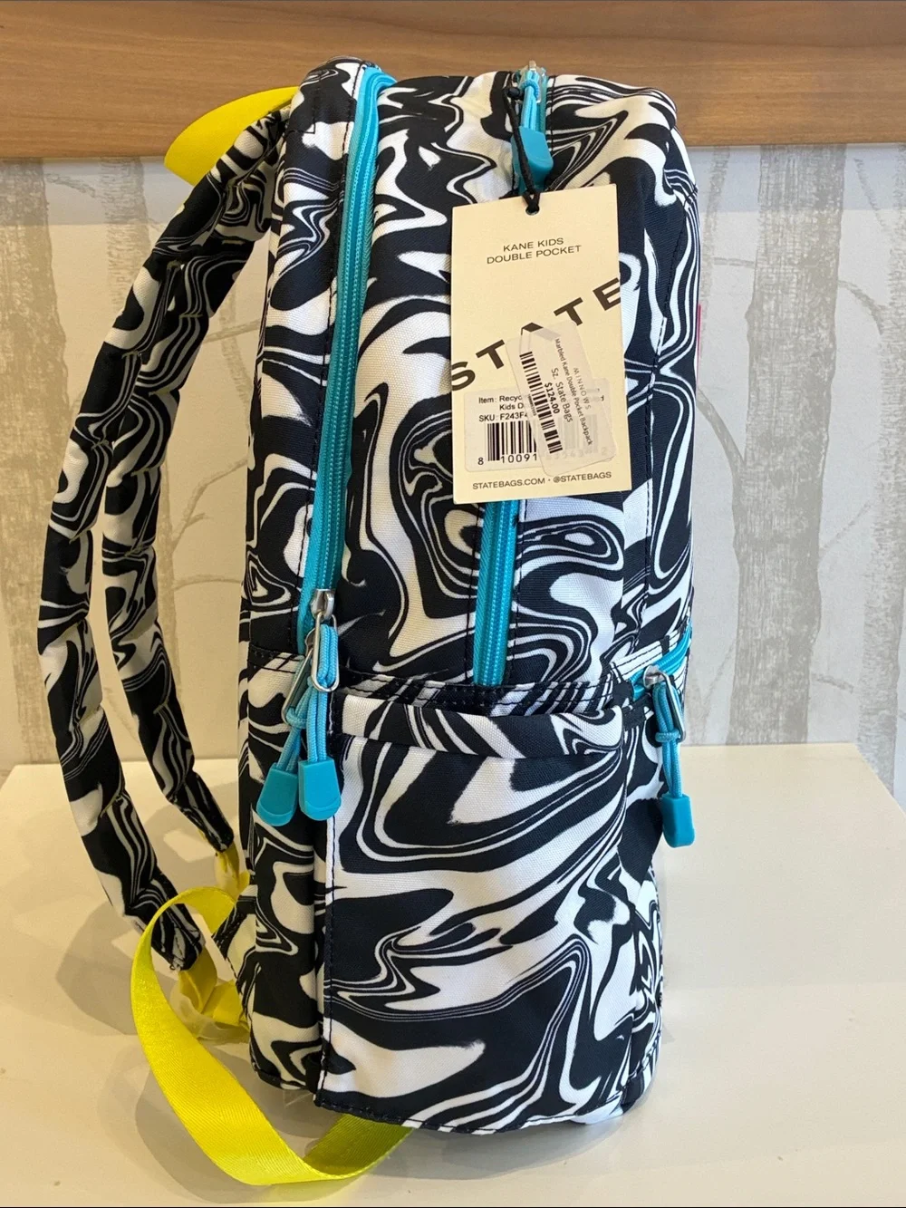 STATE Black & White Swirl Backpack with Pink Logo and Teal Accents